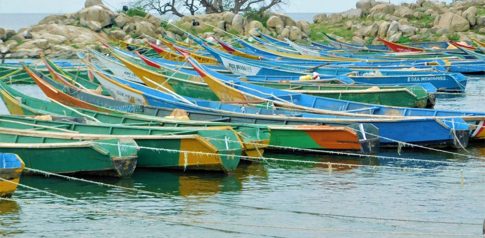 Boats docked on the shores of Lake Albert in Uganda - Photo - The African Great Lakes